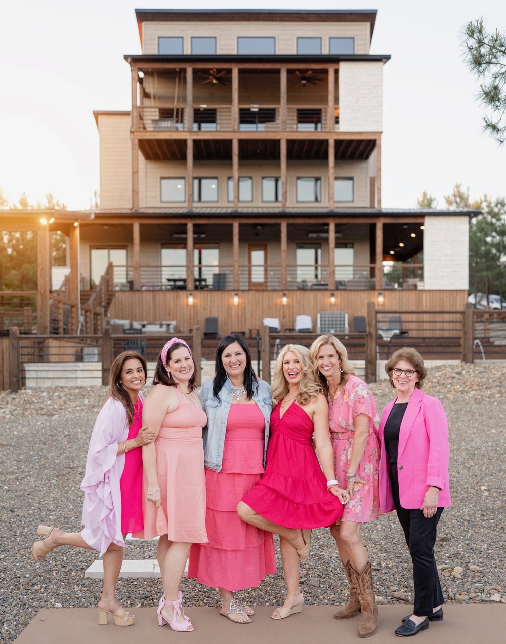 Vary-8 retreat group at the lake house in pink dresses